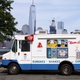 Mister Softee truck parked in front of city skyline